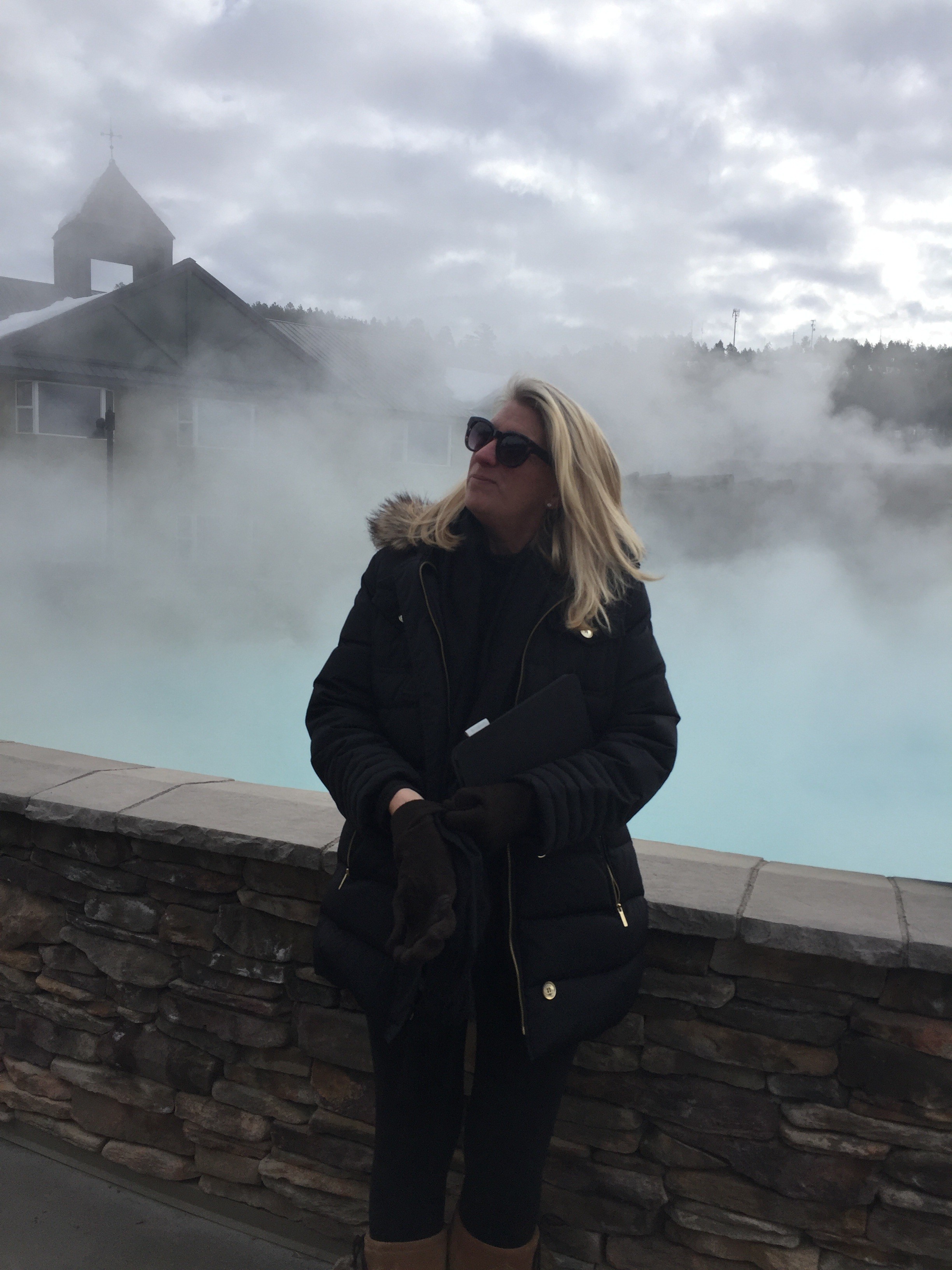 Outdoor hot springs surrounded by mountain scenery